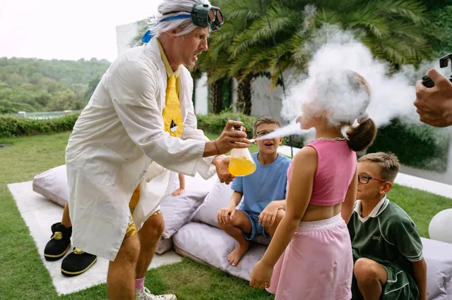 Mad scientist entertaining kids with cold steam experiments in Bali