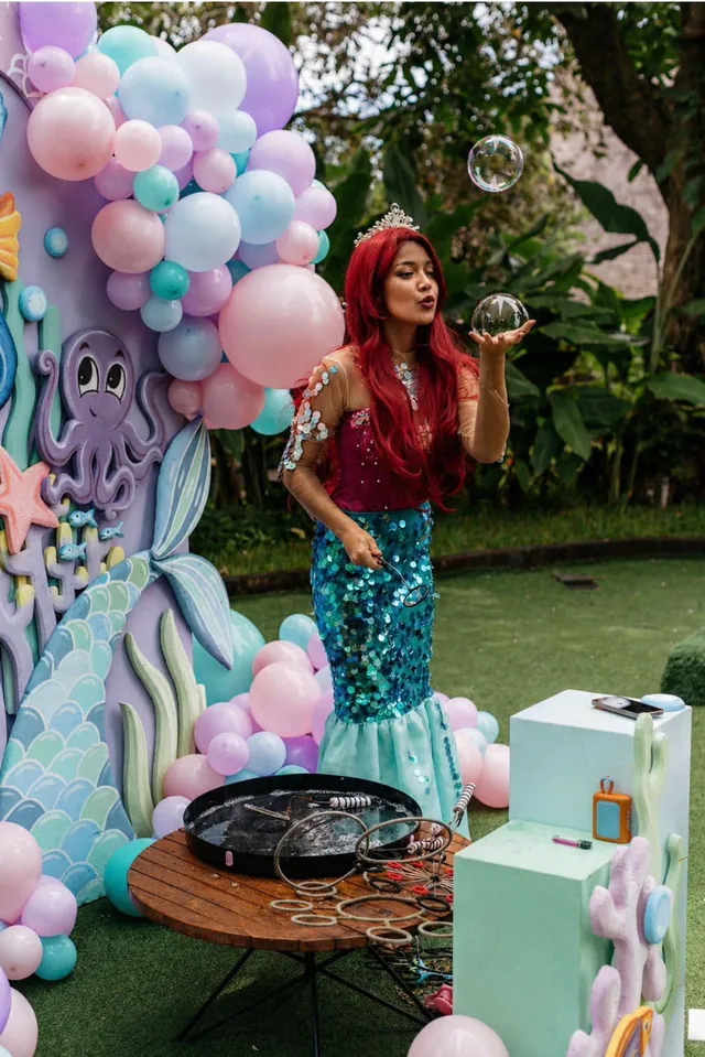 Mermaid character at a pastel under-the-sea balloon photo zone in Bali