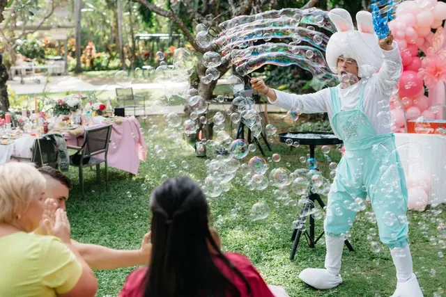 Bubble show performer amazing the audience at a Bali party