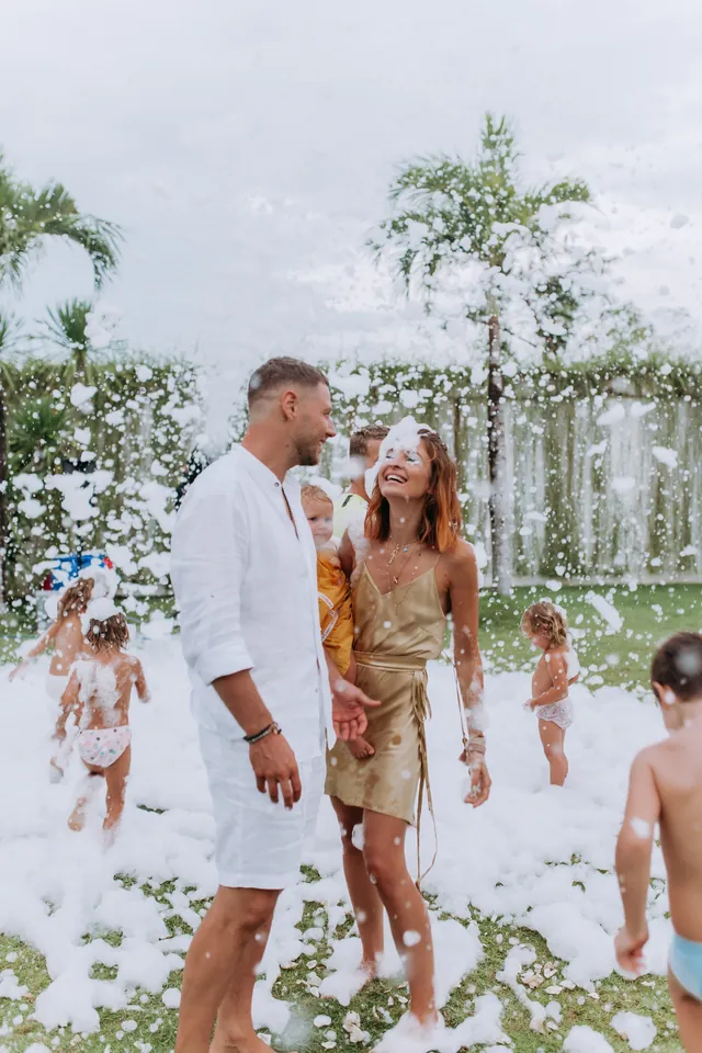 Parents and kids enjoying a foam party at a Bali villa