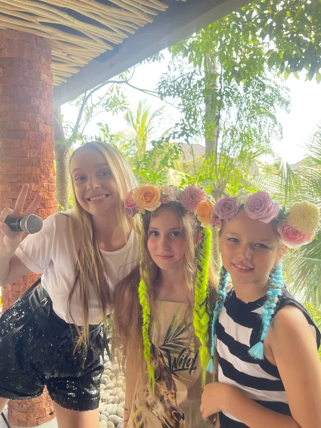 Three girls in flower crowns at a Bali kids party