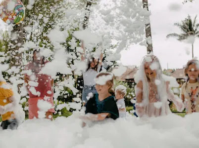 Group of kids covered in foam having fun at a Bali foam party