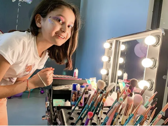 Young guest at the beauty bar mirror at a Bali party