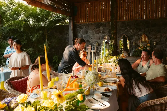 Guests enjoying the catered party table at a Bali villa