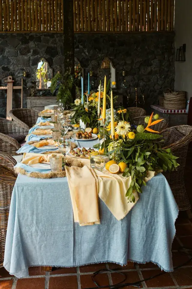 Long decorated party table with flowers and candles at a Bali villa