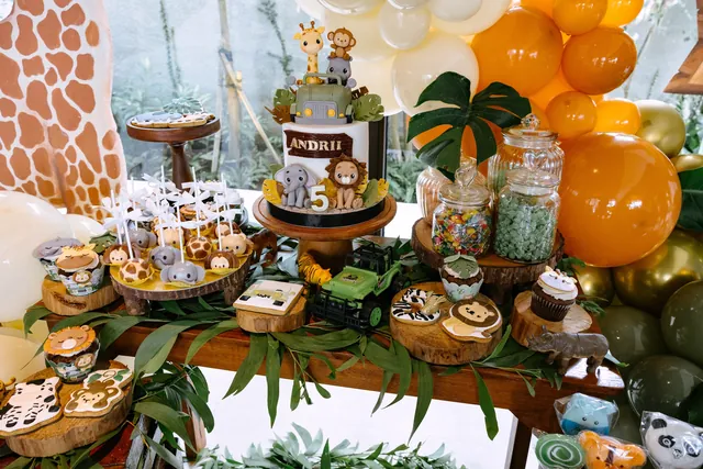 Safari-themed dessert table with cupcakes and treats in Bali