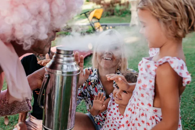 Girl amazed by cold steam during the science show in Bali