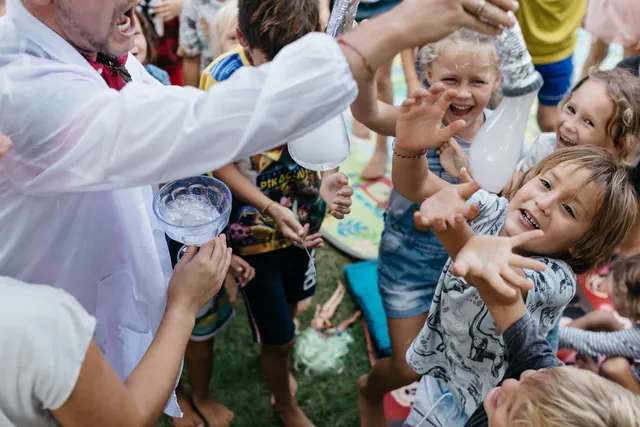 Children catching nitrogen ice during a science show in Bali