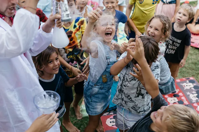 Laughing kids at the liquid nitrogen science show in Bali
