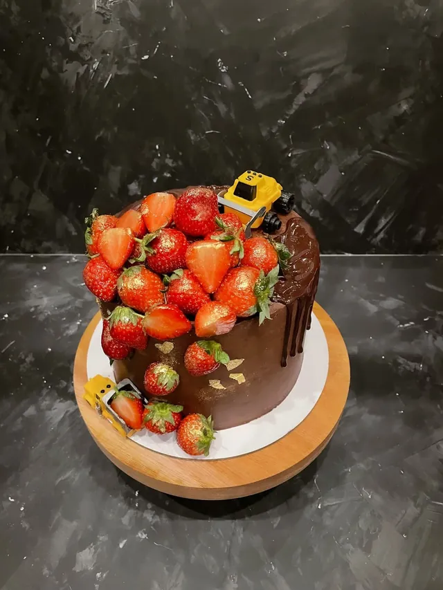 Chocolate birthday cake loaded with fresh strawberries